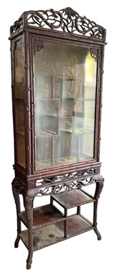 Lot 1002 - A late 19th/early 20th century Chinese carved...