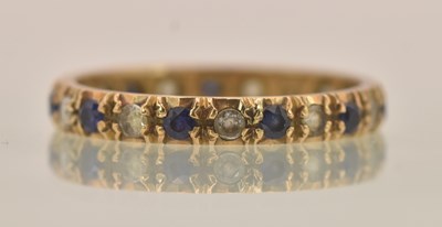Lot 1345 - A 9ct yellow gold sapphire and white stone set...