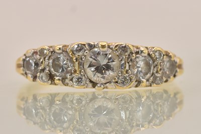 Lot 1236 - An 18ct yellow gold diamond cluster ring from...