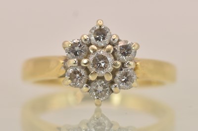 Lot 1237 - An 18ct yellow gold diamond set flower head...