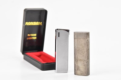 Lot 2255 - CARTIER; a cigarette lighter with engine...