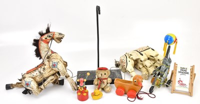 Lot 1824 - Two carved and painted wood puppets,...