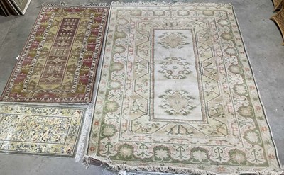 Lot 882 - Two Turkish machine made rugs, the larger...