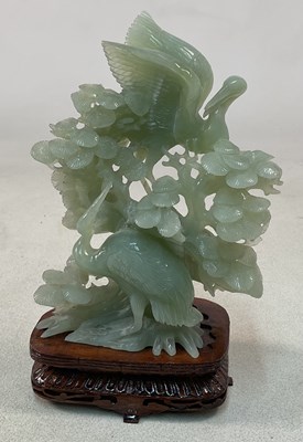 Lot 692 - A jade figural group of two cranes amongst...