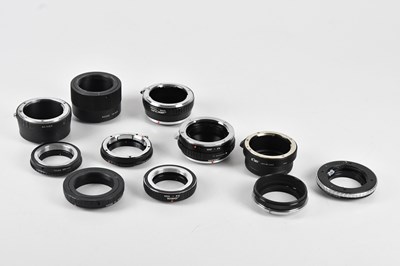 Lot 135 - A collection of lens adapters, to include a...
