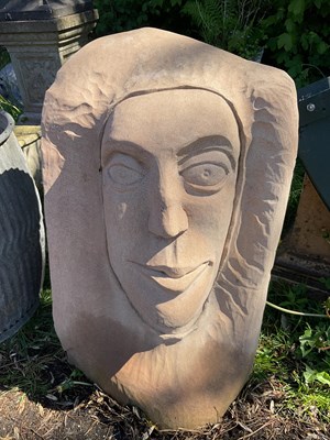 Lot 2147 - A carved sandstone garden statue modelled as a...