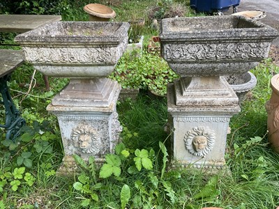 Lot 2140 - A pair of reconstituted stone garden planters...