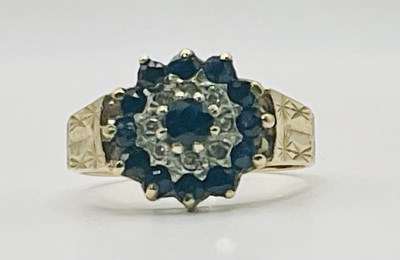 Lot 675 - A 9ct yellow gold blue topaz and diamond...