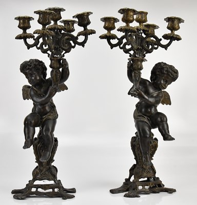 Lot 604 - A pair of reproduction bronze candelabra in...