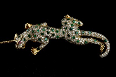 Lot 115 - An 18ct yellow and white gold diamond, emerald,...