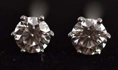Lot 163 - A pair of 18ct white gold diamond solitaire...