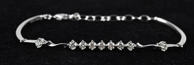 Lot 112 - An 18ct white gold diamond set bracelet, set...