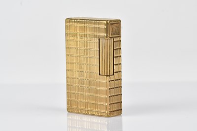 Lot 1270 - S L DUPONT; a gold plated cigarette lighter...