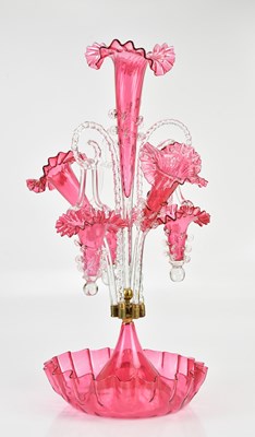 Lot 1209 - A Victorian cranberry glass epergne with three...