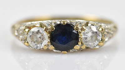 Lot 568 - A 9ct yellow gold three stone dress ring, set...