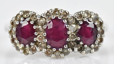 Lot 462 - A diamond and ruby cluster dress ring, set...