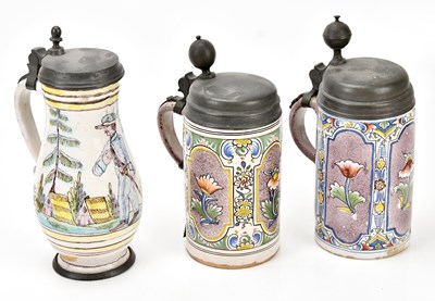 Lot 1309 - Two 18th century German faience ware tankards...
