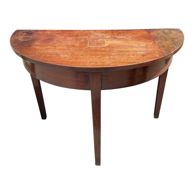 Lot 1311 - A Georgian mahogany demi-lune console table on...