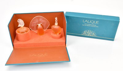 Lot 1624 - LALIQUE; a perfume set, boxed.