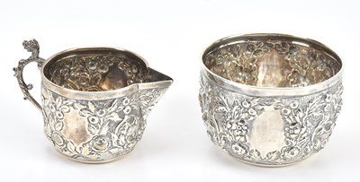 Lot 402 - A hallmarked silver cream jug and sugar bowl