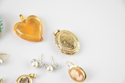 Lot 16 - A yellow metal mounted pendant set with an...