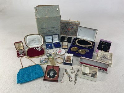 Lot 696 - A quantity of costume jewellery, handbags, and...