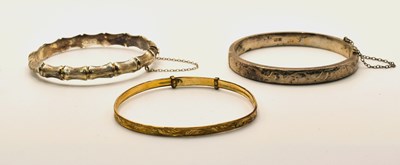 Lot 689 - A hallmarked silver hinged bangle, Birmingham...