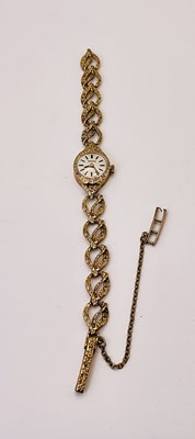Lot 715 - INVICTA; a 9ct gold lady's wristwatch, on...