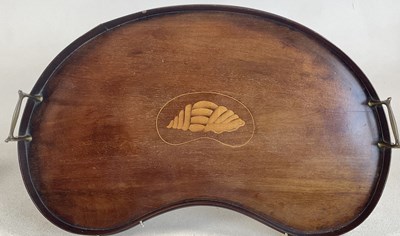 Lot 853 - A mahogany kidney shaped tray with central...