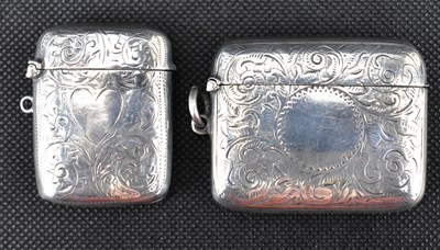 Lot 847 - Two hallmarked silver floral decorated vesta...