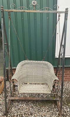 Lot 889 - A garden swing with metal frame and plastic...