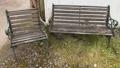 Lot 908 - A garden bench with cast iron supports, height...