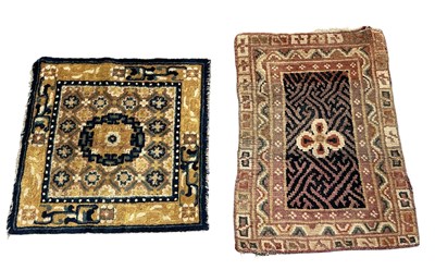 Lot 129 - Two early 20th century Tibetan woollen mats...