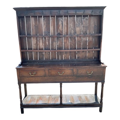 Lot 42 - An 18th century oak dresser, with boarded...