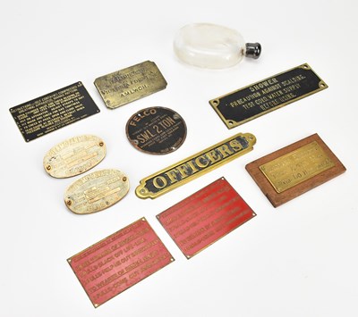 Lot 518 - A collection of vintage metal plaques and name...
