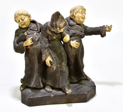Lot 1281 - A German ceramic figure group of three drunken...