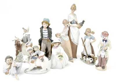 Lot 1276 - LLADRÓ; eight ceramic figures including a...