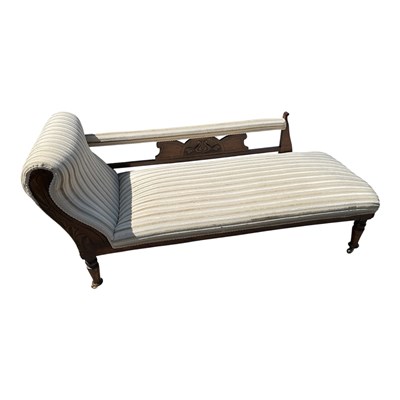 Lot 1272 - An Edwardian carved walnut chaise longue on...