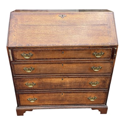 Lot 202 - An 18th century oak bureau with fall front...