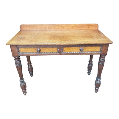 Lot 166 - A Victorian carved oak two drawer side table...