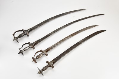 Lot 618 - A group of four tulwars, largest 83cm (4).