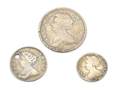 Lot 563 - A Queen Anne 1709 half crown, a 1711 shilling,...