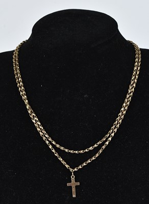 Lot 267 - A 9ct gold cross pendant, suspended on a 9ct...