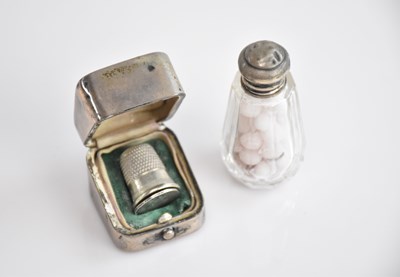 Lot 210 - A hallmarked silver thimble case and scent bottle