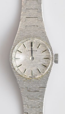 Lot 1238 - LONGINES; a lady's sterling silver wristwatch,...