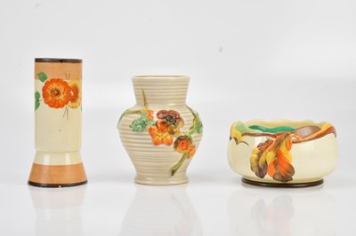 Lot 1500 - CLARICE CLIFF; a hand painted cylindrical vase...