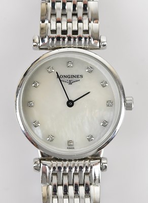 Lot 1156 - LONGINES; a lady's stainless steel wristwatch,...