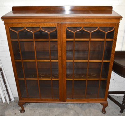 Lot 1592 - An early 20th century walnut display cabinet