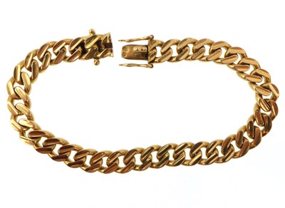 Lot 988 - A gold heavy curb bracelet with additional...