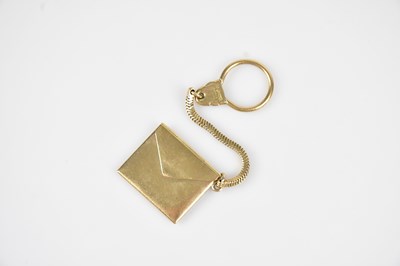 Lot 4 - A 9ct yellow gold stamp holder formed as an...